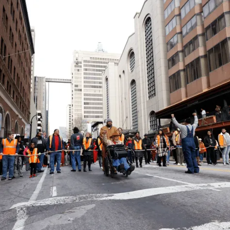 View of people marching in the street. 