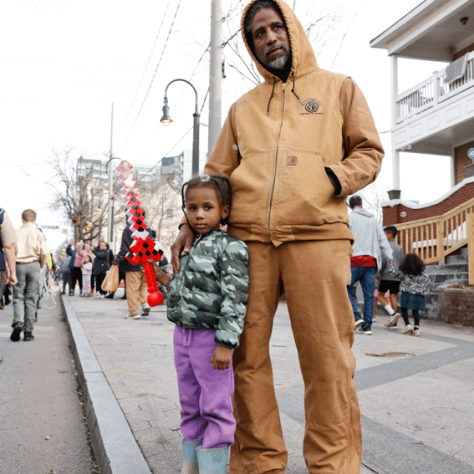 Man posing with child. 