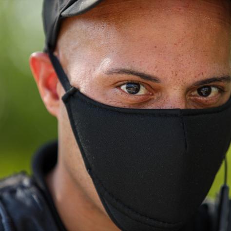 Close up of man in black mask. 