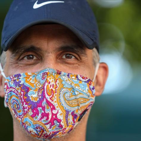 Close up of man in colorful mask. 