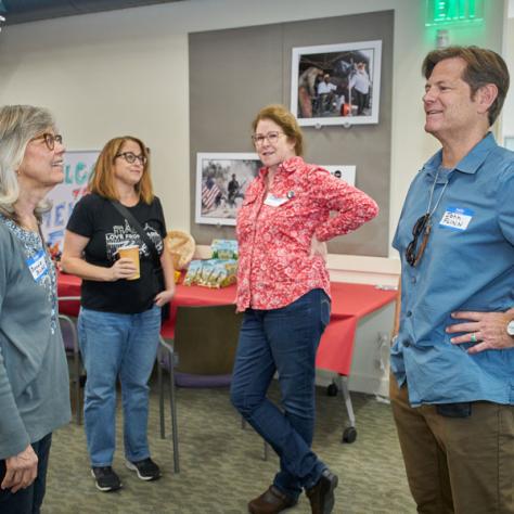 People talking together at party. 