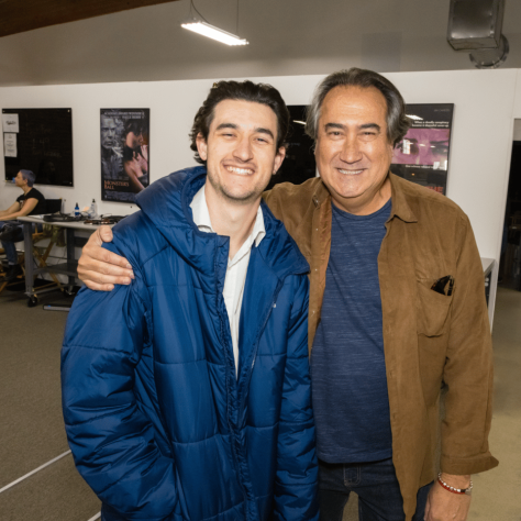 Two men posing for a photo. 