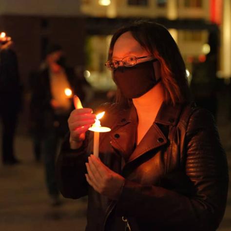 Woman holding a candle. 