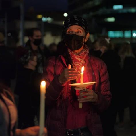 People holding candles. 