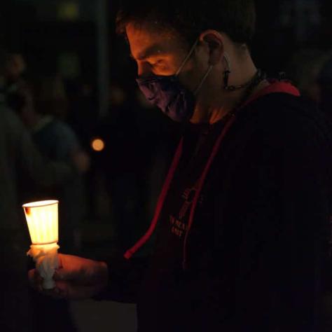 Man holding a candle. 