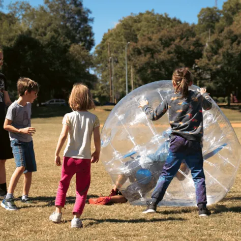 Kids playing with inflatable ball. 