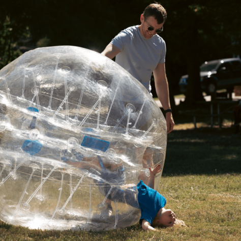 Kid inside inflatable ball. 