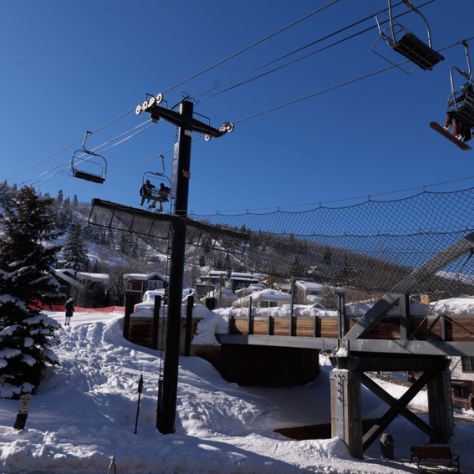 Ski lifts and snow outside. 