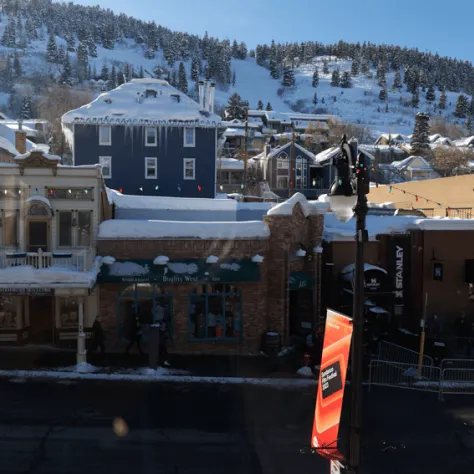 outside view of homes, hill with snow.