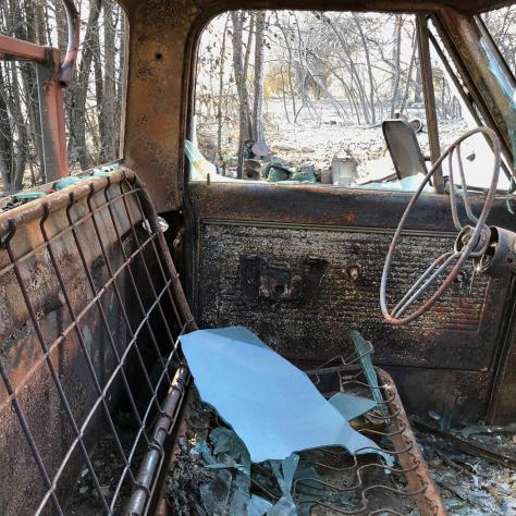 Inside of an old stripped truck. 