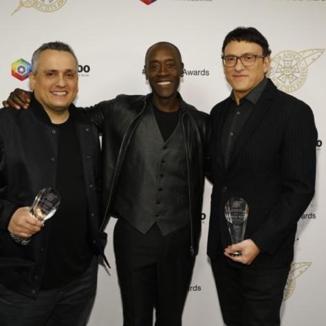 Joe and Anthony Russo, Motion Picture Showman of the Year, with presenter Don Cheadle